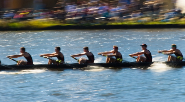 Speeding rowing boat with motion blur to accent speed.